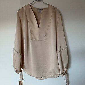 Blouse ample de couleur dorée à manches bouffantes